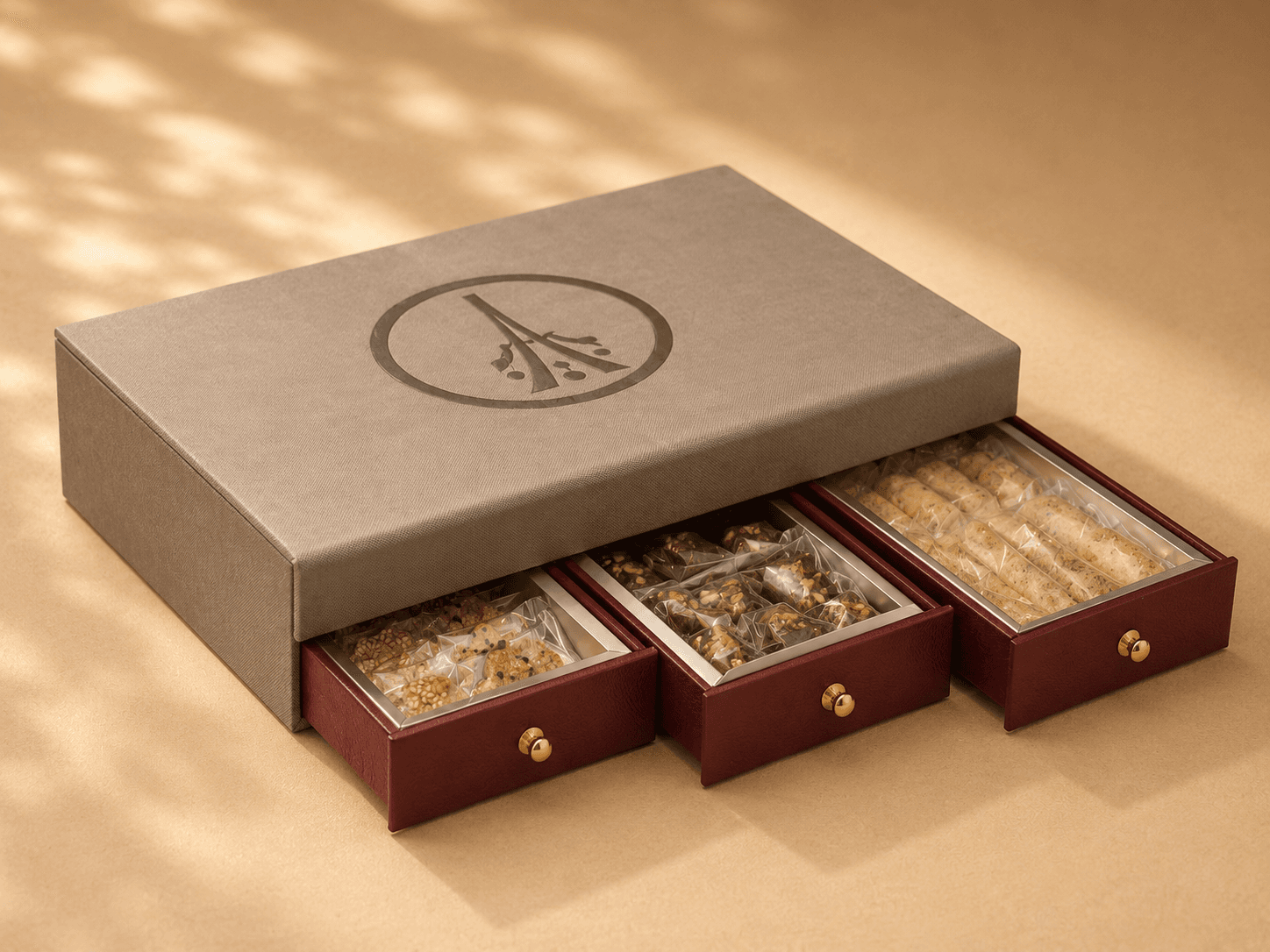Petalen branded grey gift box with three sliding burgundy drawer compartments